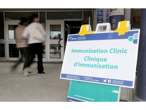 People arriving for their COVID-19 vaccination at the Nepean Sportsplex in Ottawa