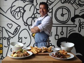 Chef Lizardo Becerra of Raphael Express with some of his dishes at his restaurant in Ottawa Wednesday.