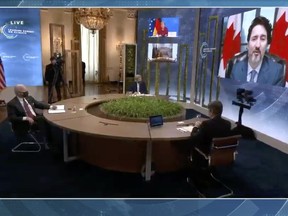 Justin Trudeau, Canada's prime minister, right, speaks during the virtual Leaders Summit on Climate in a video screenshot on Thursday, April 22, 2021.
