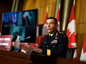 Maj.-Gen. Dany Fortin participates in a news conference on the COVID-19 pandemic earlier this year. He has been removed from his post heading the federal vaccine effort while under investigation.