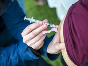 A patient is vaccinated at a 'Japapalooza' event organized by Ottawa Dr. Nili Kaplan-Myrth