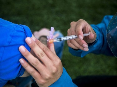 Dr Nili Kaplan-Myrth held her second Jabapalooza on the outdoor athletic field at Immaculata High School on Saturday, vaccinating 330 people with the help of approximately 25 volunteers and 10 medical students. University of Ottawa medical student Harry Wang took part in helping give vaccines.