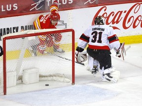 Calgary Flames Johnny Gaudreau scores on Ottawa Senators goalie Anton Forsberg in first period NHL action at the Scotiabank Saddledome in Calgary on Sunday, May 9, 2021.