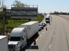 Traffic backed up on the westbound lanes of Highway 401 in Kingston, Ont., on Friday, May 14, 2021. Two collisions closed the highway, one person was seriously injured.
