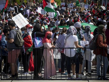 Thousands marched in downtown Ottawa on Saturday to protest the continuing violence in East Jerusalem.