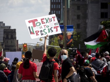 Protesters of the continuing violence in East Jerusalem are shown on Elgin St. in downtown Ottawa.