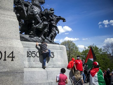 Crowds police estimated at 3,000 marched in downtown Ottawa Saturday to protest the continuing violence in East Jerusalem Saturday, May 15, 2021. Protestors unsuccessfully tried to gain access to the top of the War Memorial Saturday.