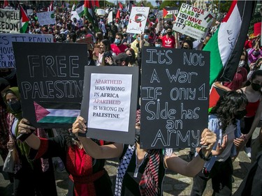 Crowds police estimated at 3,000 marched in downtown Ottawa Saturday to protest the continuing violence in East Jerusalem