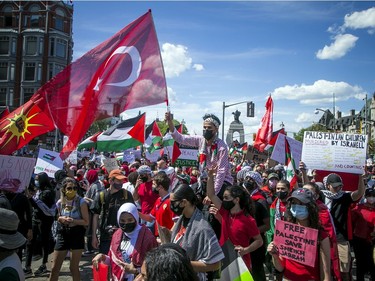 Crowds police estimated at 3,000 marched in downtown Ottawa on Saturday to protest the continuing violence in East Jerusalem.