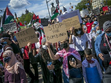 Crowds police estimated at 3,000 marched in downtown Ottawa on Saturday to protest the continuing violence in East Jerusalem.
