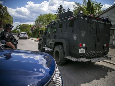 Ottawa police had numerous officers from multiple units at a housing complex on Hochelaga Street, Sunday, May 16, 2021. OPS's tactical armoured vehicle, known as the BearCat arrived on the scene Sunday.