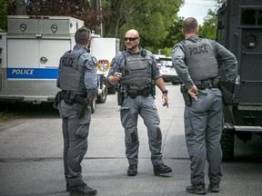 Ottawa police had numerous officers from multiple units at a housing complex on Hochelaga Street, Sunday, May 16, 2021.