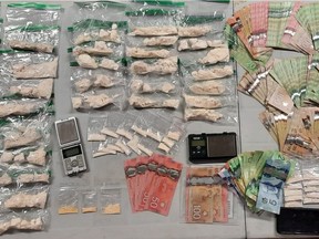 Provincial police released this image of drugs, cash and other items seized Thursday in Elgin and Kingston.