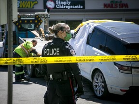 Ottawa police were on the scene of the double homicide of Abdulaziz Abdullah and Mohamad Abdullah on Saturday. A Range Rover was towed from the mall parking lot on Saturday morning.
