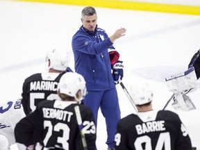 Head coach Sheldon Keefe speaks to Maple Leafs players during an on-ice practice in Toronto last July.