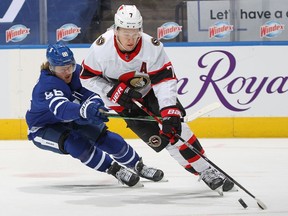 Brady Tkachuk of the Ottawa Senators controls the puck against William Nylander of the Toronto Maple Leafs during an NHL game at Scotiabank Arena on Feb. 15, 2021 in Toronto, Ontario, Canada. The Senators defeated the Maple Leafs 6-5 in overtime.