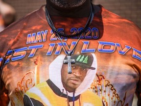 One man's T-shirt tells the story, as people gather on May 25, 2021 in Minneapolis, Minnesota to mark a year since the death of George Floyd.