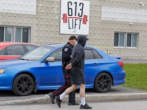 On Wednesday afternoon, an Ottawa bylaw officer issued tickets to about a half-dozen members of 613 Lift 
(a weightlifting gym) outside of its door. Ottawa police handcuffed one individual at the scene, but that man was soon released.