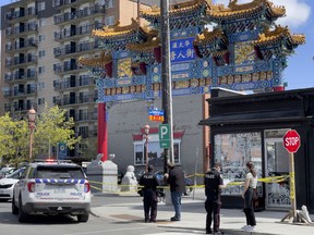 Ottawa police investigating at Somerset Street West and Cambridge Street North in the Chinatown area of the city on Thursday.