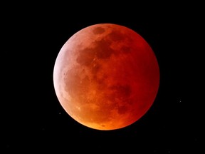 A total lunar eclipse that is called a 'Super Blood Wolf Moon' is seen from Encinitas, California, on January 20, 2019.