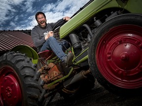 Beau's CEO Steve Beauchesne takes a moment from his busy day at the brewery to have a little fun on the iconic tractor parked in front of the Vankleek Hill family-run business.