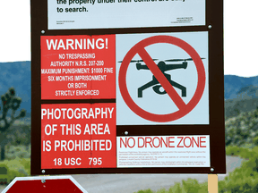 A warning sign is posted at the perimeter of the top-secret military installation at the Nevada Test and Training Range known as Area 51 on July 22, 2019 near Rachel, Nevada.