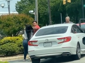 A man and woman were captured on video fighting at a gas station in North Carolina on Tuesday.