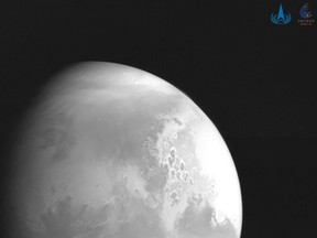 This handout photograph released on February 5, 2021 by the China National Space Administration (CNSA) showing an image of Mars captured by China's Mars probe Tianwen-1.