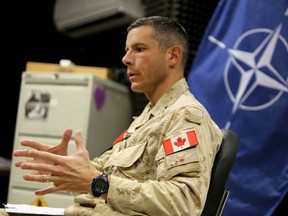 In this file photo taken in 2019, Maj.-Gen. Dany Fortin, then the commander of NATO Mission Iraq (NMI), speaks during an interview in Baghdad. The general left his post in charge of coordinating Canada's Covid-19 vaccination campaign amid a probe of his conduct.