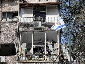 A picture shows damaged buildings in Ramat Gan near the coastal city of Tel Aviv, on May 16, 2021, a day after an Israeli man was killed as a result of a rockets fired by Palestinian militants in Gaza.