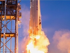 This undated handout photo obtained May 19, 2021, courtesy of Blue Origin, shows a close-up of the New Shepard rocket as it launches in West Texas. - Notice to millionaires ... A seat on a rocket is currently up for auction, but its price already exceeds $ 2.2 million, space company Blue Origin revealed.