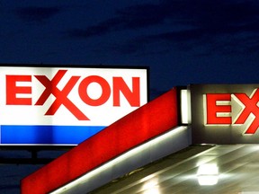 (FILES) An Exxon sign is seen at a station