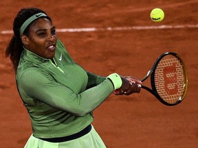 Serena Williams of the US returns the ball to Romania's Irina Begu during their women's singles first round tennis match at the court Philippe Chatrier on Day 2 of The Roland Garros 2021 French Open tennis tournament in Paris on May 31, 2021.