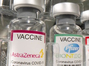 FILE: Vials of AstraZeneca and Pfizer vaccines.