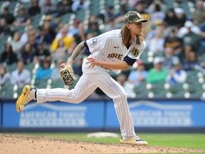 May 16, 2021; Milwaukee, Wisconsin, USA;  Milwaukee Brewers relief pitcher Josh Hader (71) delivers a pitch in the ninth inning against the Atlanta Braves at American Family Field. Final Milwaukee Brewers 10, Atlanta Braves 9. Mandatory Credit: Michael McLoone-USA TODAY Sports
