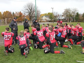 Coach Kirby Camplin congratulates his team, the Cornwall Wildcats on a game well played, Oct. 28, 2018.