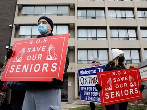 Protesters stand outside a long term care home in Toronto early this year to demand the facility invest more on resident care and staff safety.