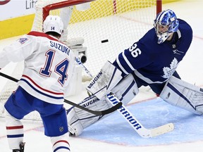 Canadiens centre Nick Suzuki scores the winning goal in overtime Thursday night, beating Maple Leafs goaltender Jack Campbell to his blocker side.