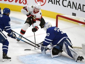 Ottawa Senators forward Brady Tkachuk shoots the puck as Toronto Maple Leafs goalie Michael Hutchinson defends in the first period at Scotiabank Arena, Feb. 18, 2021.