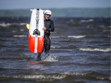 John Donovan walks into shore to switch gear Sunday.