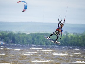 Files: High winds make for a perfect playground on the Ottawa River in the Britannia area for kiteboarders.