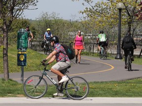 Heavy bike traffic on the NCC path near the Chaudiere Bridge in Ottawa Monday.