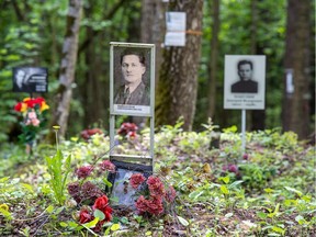A view shows portraits of victims of the repressions at an information centre opened at the Kommunarka mass burial site, which contains the remains of thousands of people executed by the NKVD secret police in 1937-41, outside Moscow.
