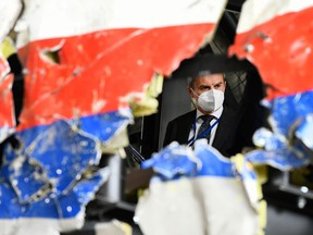 Substitute judge Daan Glass inspects the reconstruction of the MH17 wreckage, as part of the murder trial ahead of the beginning of a critical stage, in Reijen, Netherlands, May 26, 2021. REUTERS/Piroschka van de Wouw/Pool
