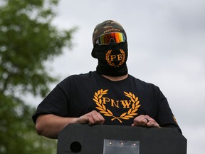 A member of Proud Boys listens to speeches during a May Day Second Amendment rally at Riverfront Park in Salem, Oregon, U.S., May 1, 2021.