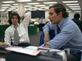 Reporters Bob Woodward, right, and Carl Bernstein, whose reporting of the Watergate case won a Pulitzer Prize, sit in the newsroom of the Washington Post, May 7, 1973. The generation of big-game hunter-journalists they inspired is now surrounded by younger recruits who view journalism as a tool to produce the changes they wish to seek in society.