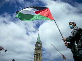FILE: Protestors gathered on Parliament Hill Sunday, May 23, 2021, to voice their concerns over the violence in Palestine.