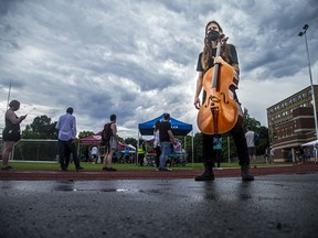 Raph Weinroth-Browne, a cello player with Ottawa Chamberfest was one of a few musicians on site to entertain the Jabapalooza crowd Saturday. The weather caused a slight pause in the performances but workarounds were quickly organized at Dr. Nili Kaplan-Myrth's third Jabapalooza held on the field at Immaculata High School, Saturday,