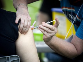 A shot of Moderna vaccine being administered at a  clinic on June 5, 2021  organized by Dr. Nili Kaplan-Myrth. '