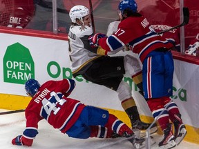 Canadiens' Paul Byron and rJosh Anderson crunch Golden Knights defenceman Zach Whitecloud Sunday night at the Bell Centre. Anderson led the team with 10 hits in the contest.